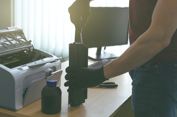 Laser cartridge toner refill concept. Office equipment maintenance concept.