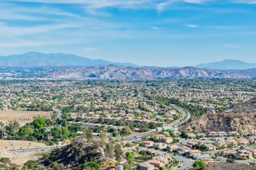 Road to middle of Southern California inland city on clear fall day