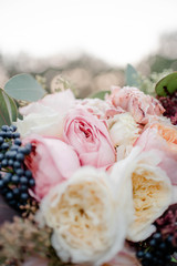 Wedding flowers, bridal bouquet closeup. Decoration made of roses, peonies and decorative plants, close-up, selective focus, objects