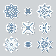 Set of snowflakes. Beautiful winter ornament. Collection of stickers of snowflakes to cut out. Christmas paper Icons