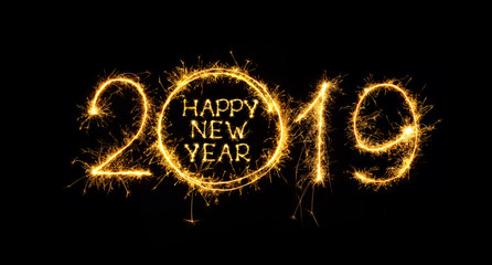 Happy New Year 2019 written sparklers on black background