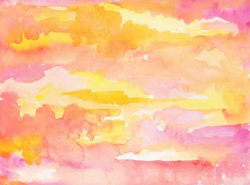 watercolor sky background wash with sunrise and sunset clouds painted in pink yellow orange and purple colors on watercolor paper texture