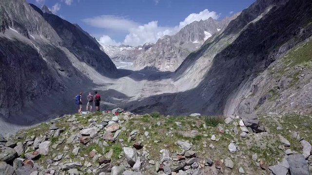 Hikers revealing shot with Oberaletsch glacier