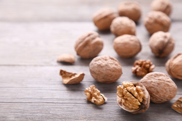 Walnuts kernels on grey wooden background. Walnut healthy food