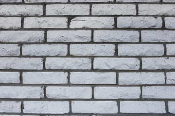 Natural vintage  grungy white or grey seamless brick wall. A concept of grunge, material, aged