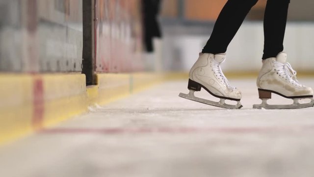 Close-up Of Skates When Going On Ice Rink.
