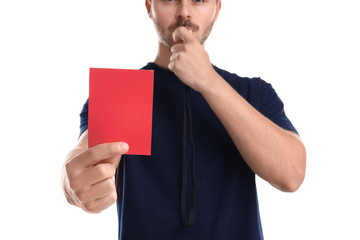 Football referee with whistle holding red card on white background, closeup