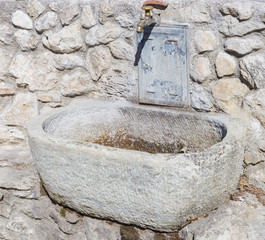 Historical fountain still working at the foot of Castel di Tora. Lake Turano, Lazio, Italy.