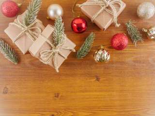 Obraz na płótnie Canvas Flat lay,top view Christmas ornaments and gift boxes on wooden background with copy space 