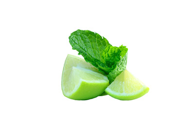 Close-up photo of green-yellow lime pieces and mint leaves; juicy pieces of fruit and bright colours isolated on white background