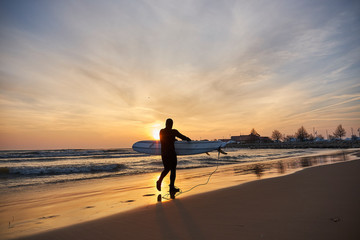 Surfing with sunrise