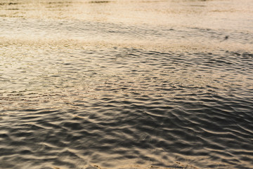 the water of the pond at sunset on the whole frame