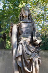 Historic Statue on the mystery old Prague Cemetery, Czech Republic