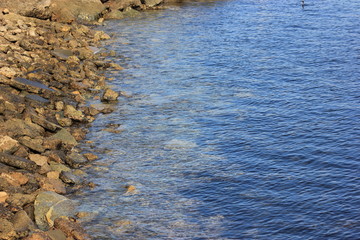 stones on the edge of the bay