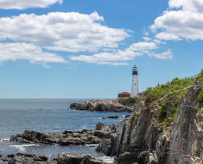 Fototapeta na wymiar Lighthouse On A Rocky Shore