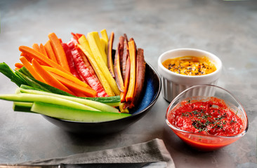 Colorful vegetable sticks in a blue plate