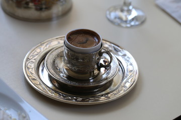 Macro photo of delicious Turkish coffee in a metal cup