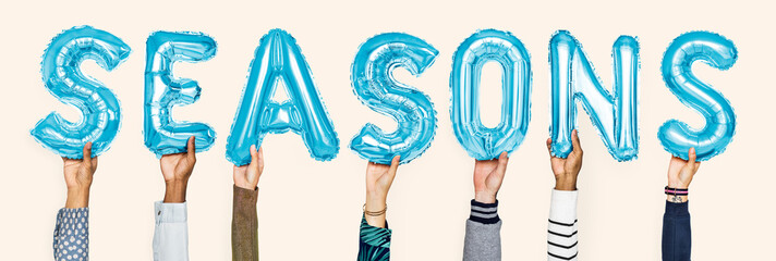 Blue alphabet balloons forming the word seasons