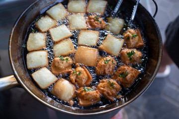 Bread in oil pan.