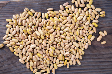 Phaseolus is scientific name of Pinto Bean legume. Also known as Frijol Pinto and Feijao Carioca. Closeup of grains, background use.