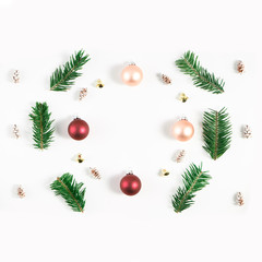 Festive composition of Christmas decorations on white background.