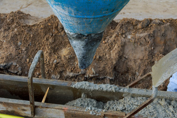 Pour concrete from concrete truck, Construction workers pouring concrete, selective focus