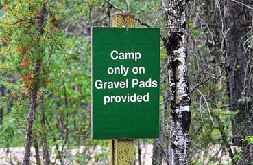 A camp only on gravel pads provided sign