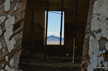 Looking out the window to the mountain peaks in the old home. 
