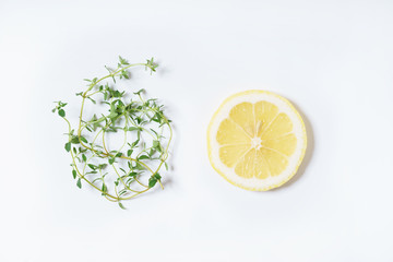 lemon and thyme on white background