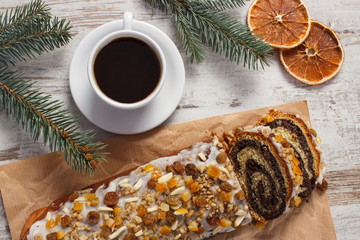 Poppy seeds cake, cup of coffee and spruce branches, christmas time