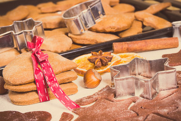 Vintage photo, Dough, accessories with ingredients for baking gingerbread and fresh baked Christmas cookies