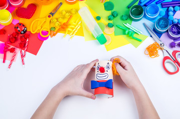 Children's hand making paper crafts