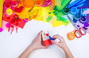 Children's hand making paper crafts