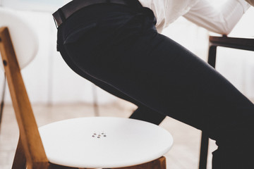 Drawing Pins on White Chair in Modern Office.