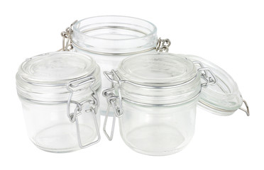 Empty glass food storage jars isolated on a white background