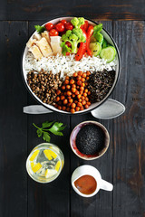 Quinoa lentil chickpeas vegetable vegetarian buddha bowl top view Healthy food
