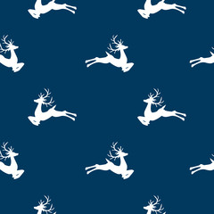 Christmas seamless pattern of reindeers on blue background. Vector illustration.