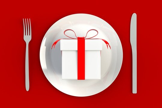 Christmas and New Year's Day, Gift box with red ribbon on plate, knife and fork on red table background, 3d rendering