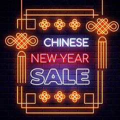 Illuminated neon signs chinese holiday light electric banner glowing on black brickwall, happy new year sale text concept with oriental asian elements. Neons sign shopping discount billboard design