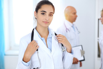 Portrait of young doctor woman  in hospital. Hispanic or latin american staff in medicine