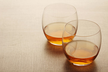 Two glasses with whiskey without ice cubes