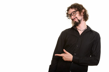 Handsome Caucasian man looking upset and pointing finger 