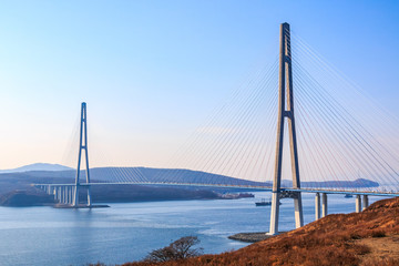 Fototapeta premium Suspended cable Russian bridge from the mainland of the Far-Eastern city of Vladivostok to the Russky island
