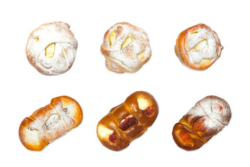 Photo from above of sweet sugar fresh pastry. Set of handmade various bun rollsm with apricot ans cherry jam, cottage cheese and powder isolated on white. Pastry in bakery isolated, top view.