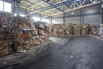 Plastic bales of rubbish at the waste treatment processing plant. Recycling separatee and storage...