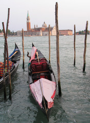 Colorful gondolas in Venice, Italy frame the island of San Giorgio Maggiore