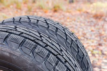 Fragment of the car tires with asymmetric tread close-up