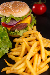 Burger with French fries cutlet with cheese and tomato