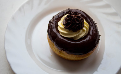 a delicious rum cake with chocolate and butter cream on a plate