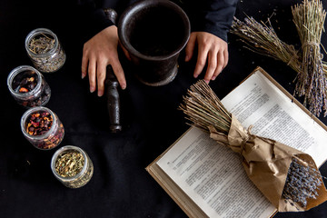 A young woman wearing a witch costume